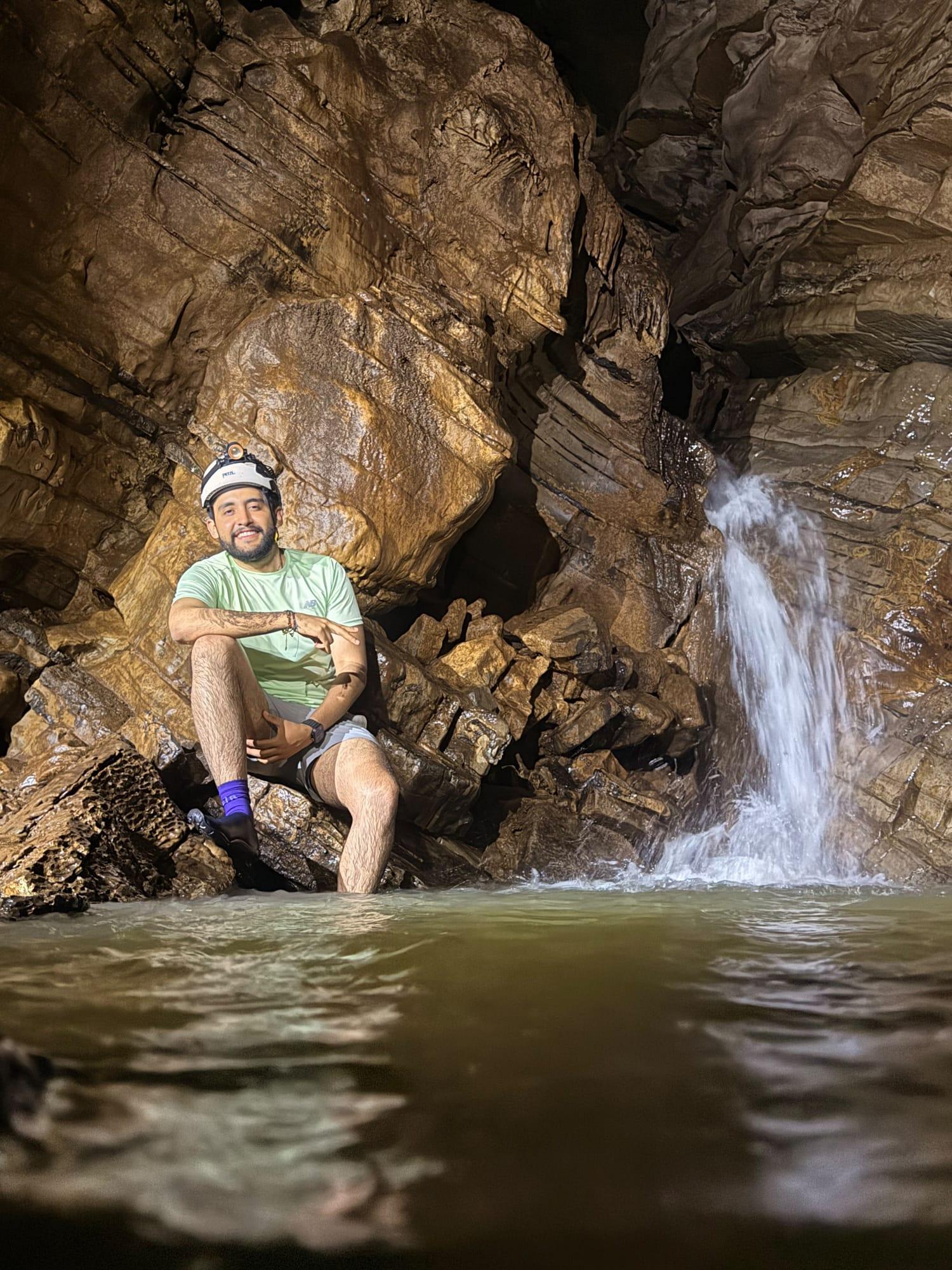 Xilo Cave — sitting next to a waterfall inside the cave